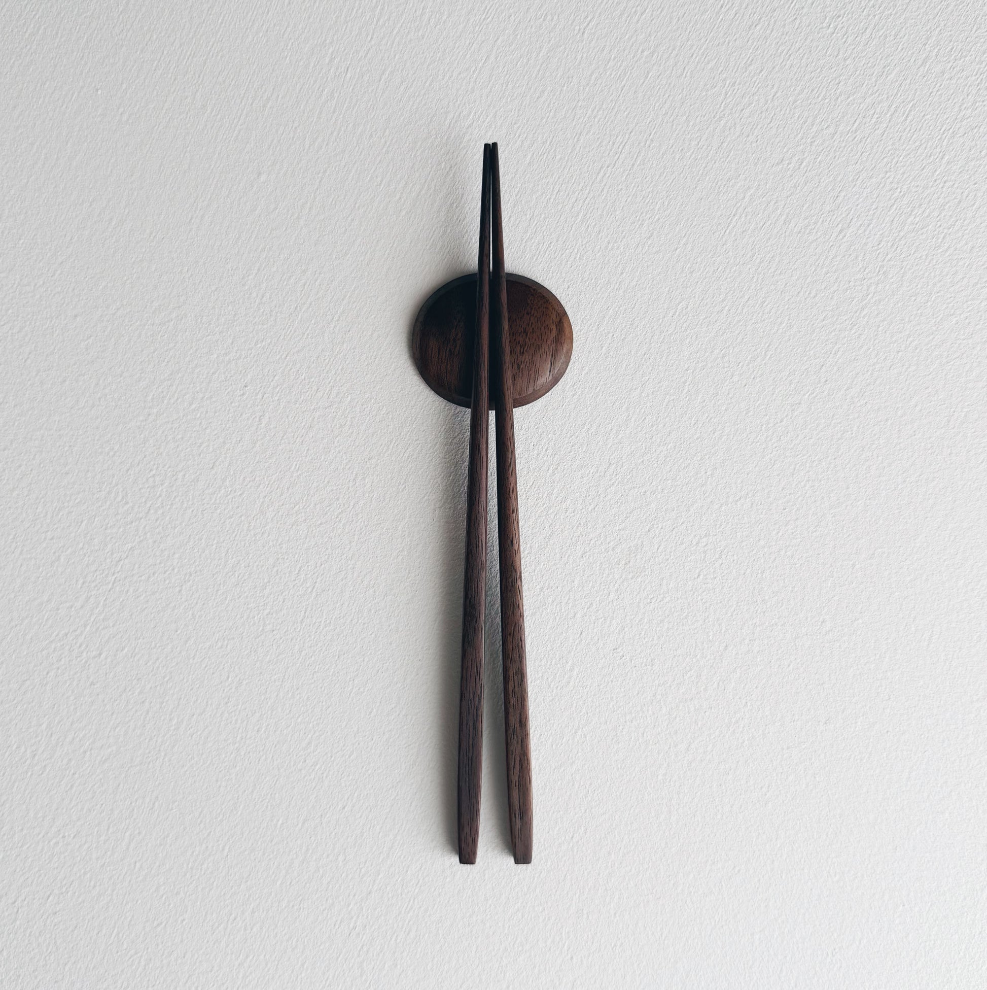 Small tapered chopsticks with pebble rest in vintage black walnut