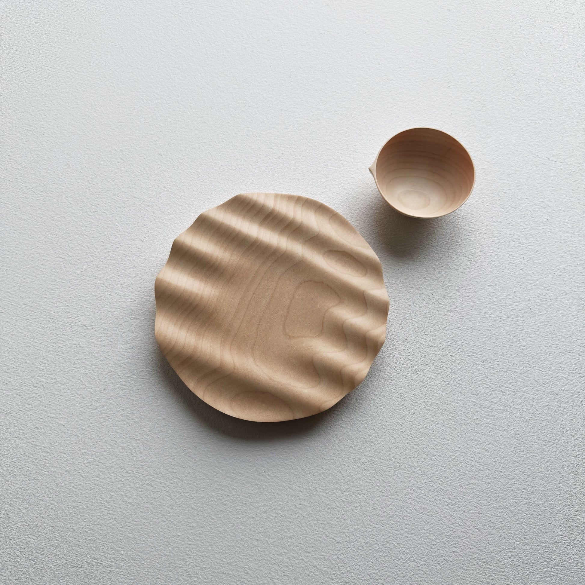 Sycamore bowl and a sycamore wavy plate on a white background