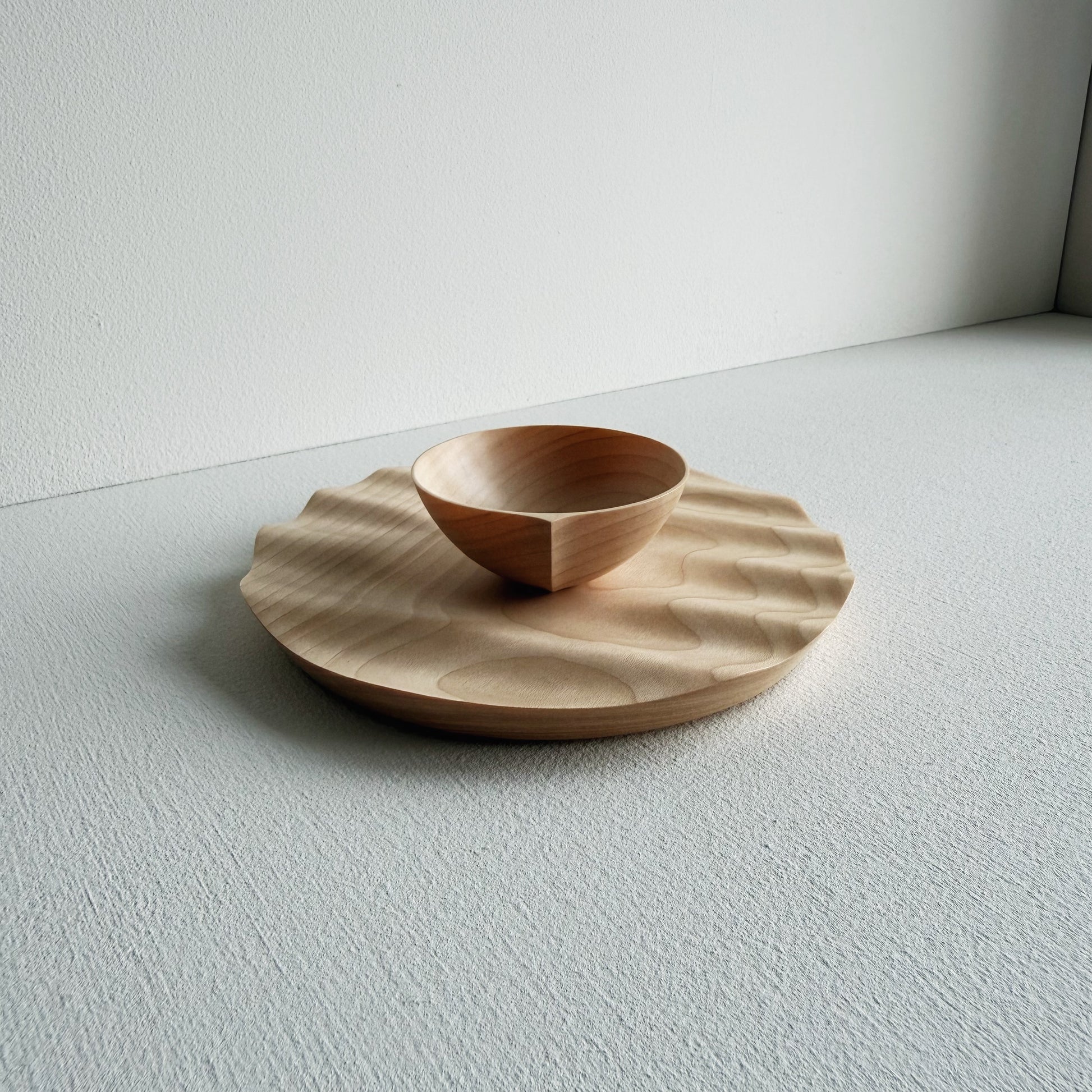 Sycamore bowl and a sycamore wavy plate on a white background