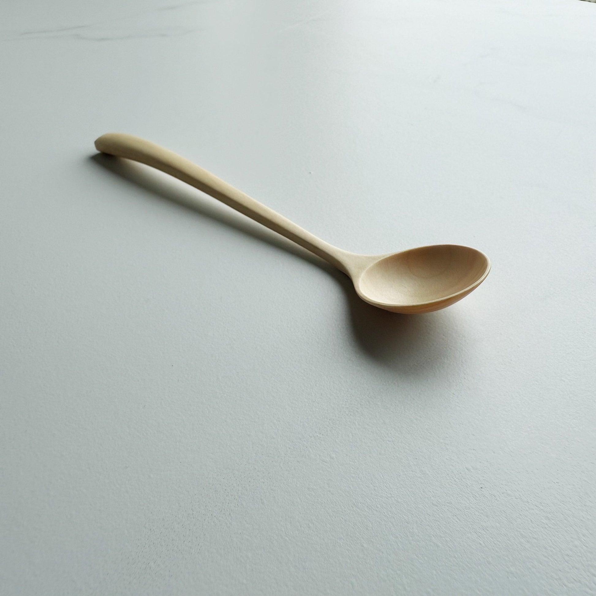 Small angled eating spoon in sycamore