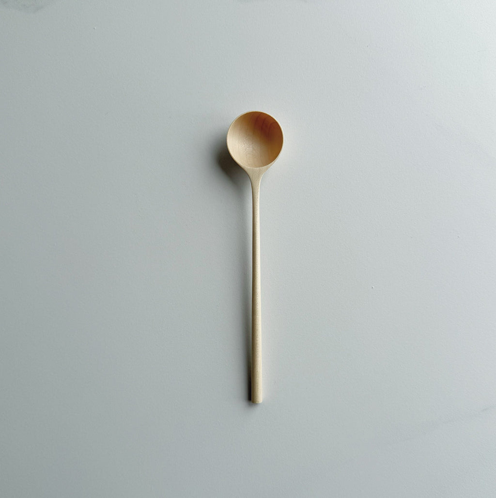 Sycamore long stem spoon on a light background
