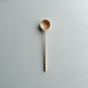 Sycamore long stem spoon on a light background
