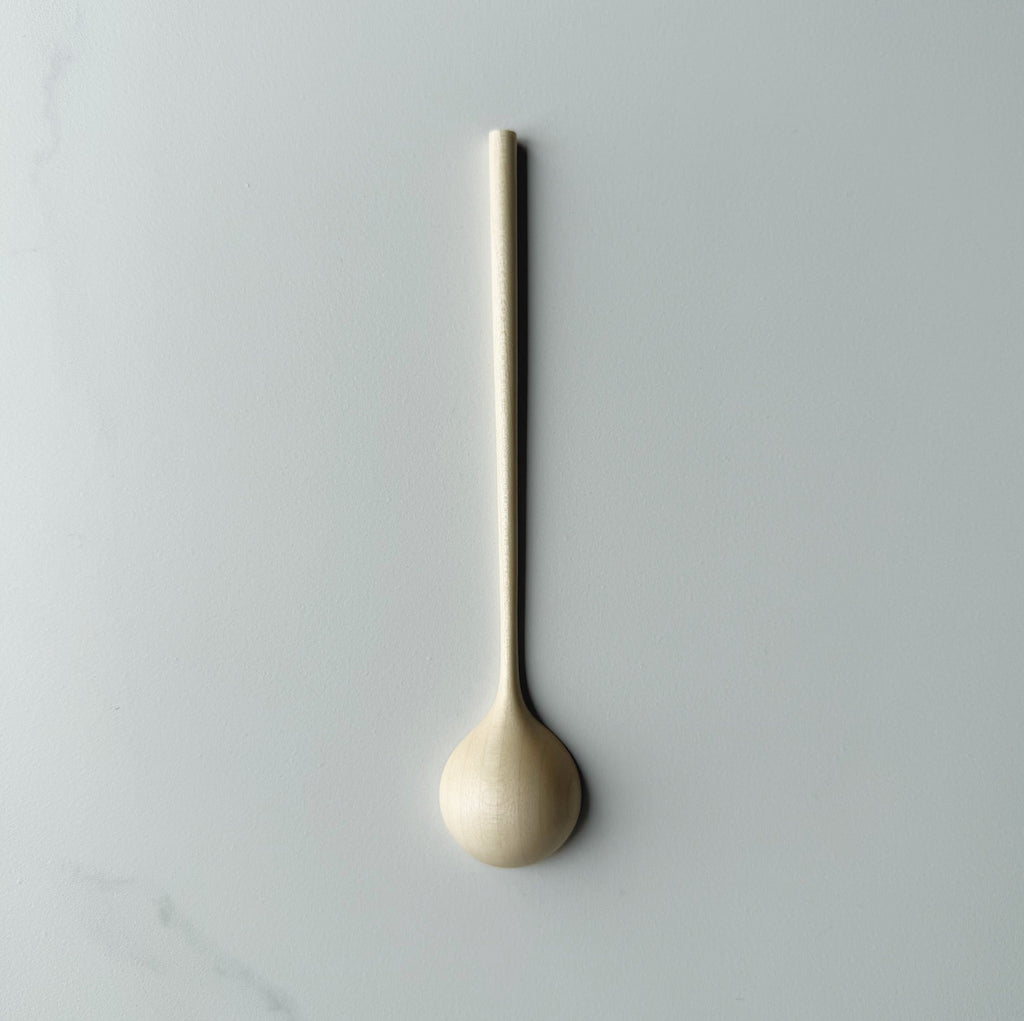 Sycamore long stem spoon on a light background
