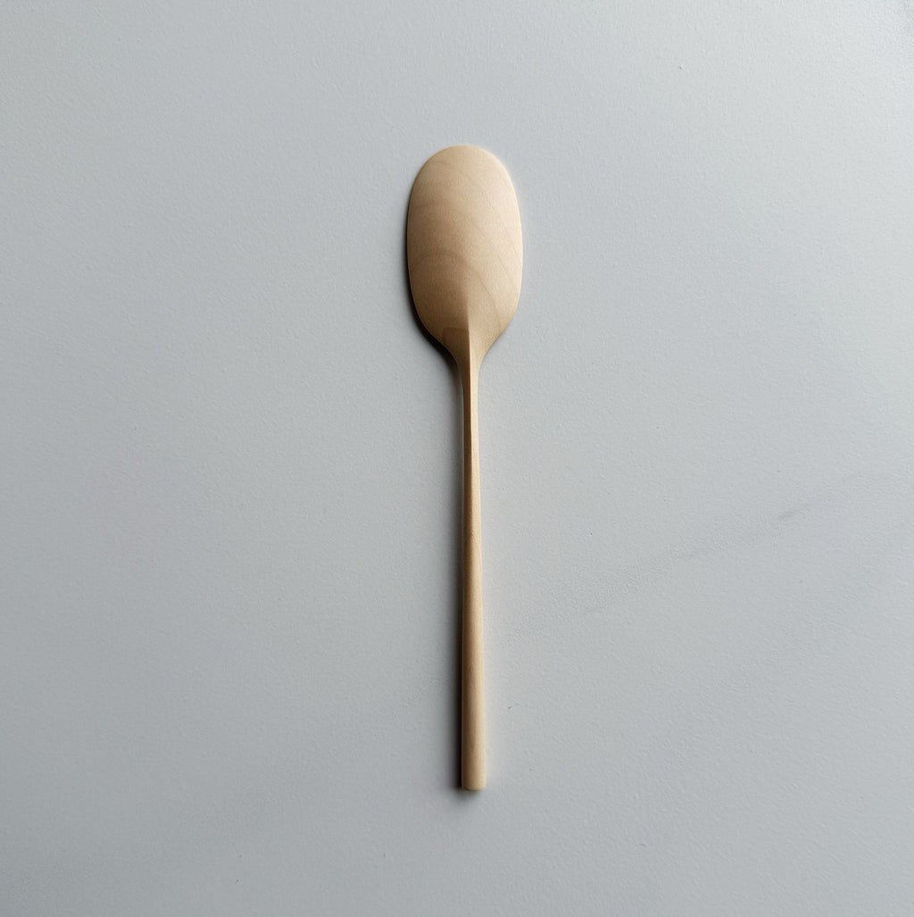 Sycamore small paddle spoon on a light background
