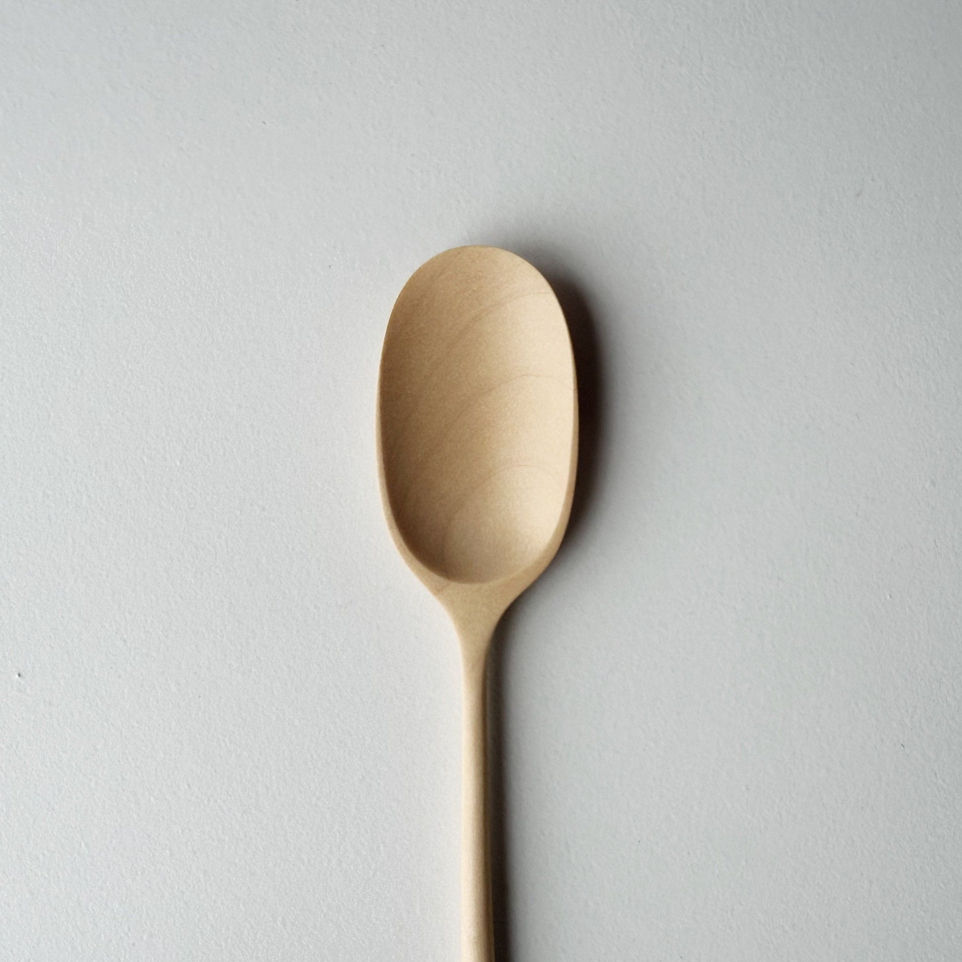Sycamore small paddle spoon on a light background
