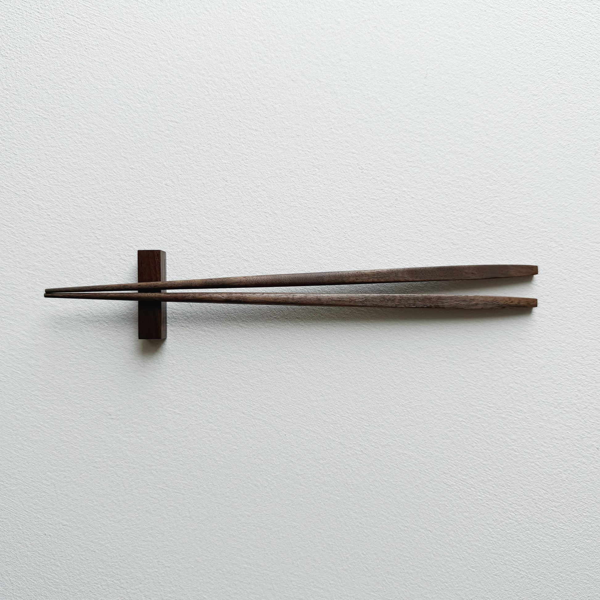 Tapered chopsticks with block rest in vintage black walnut