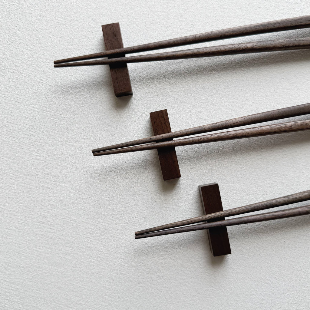 Tapered chopsticks with block rest in vintage black walnut