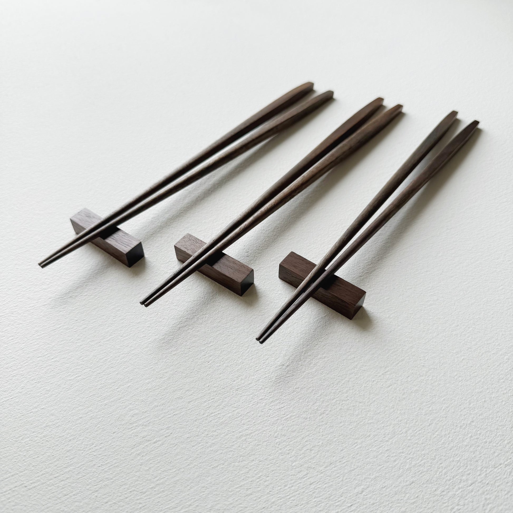 Tapered chopsticks with block rest in vintage black walnut