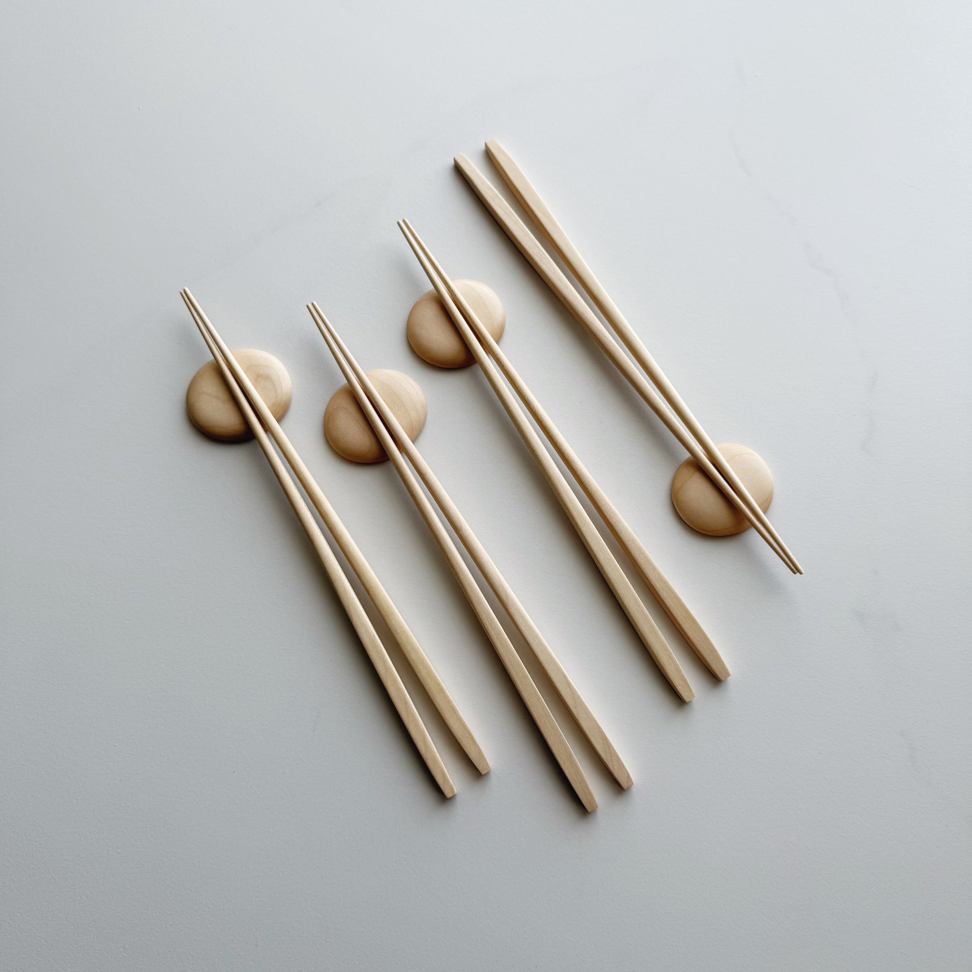 Tapered chopsticks & pebble rest in sycamore