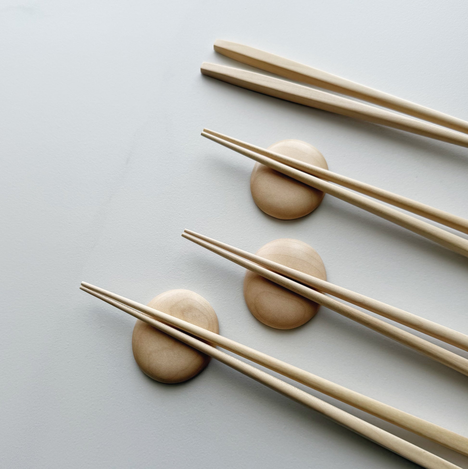 Tapered chopsticks & pebble rest in sycamore