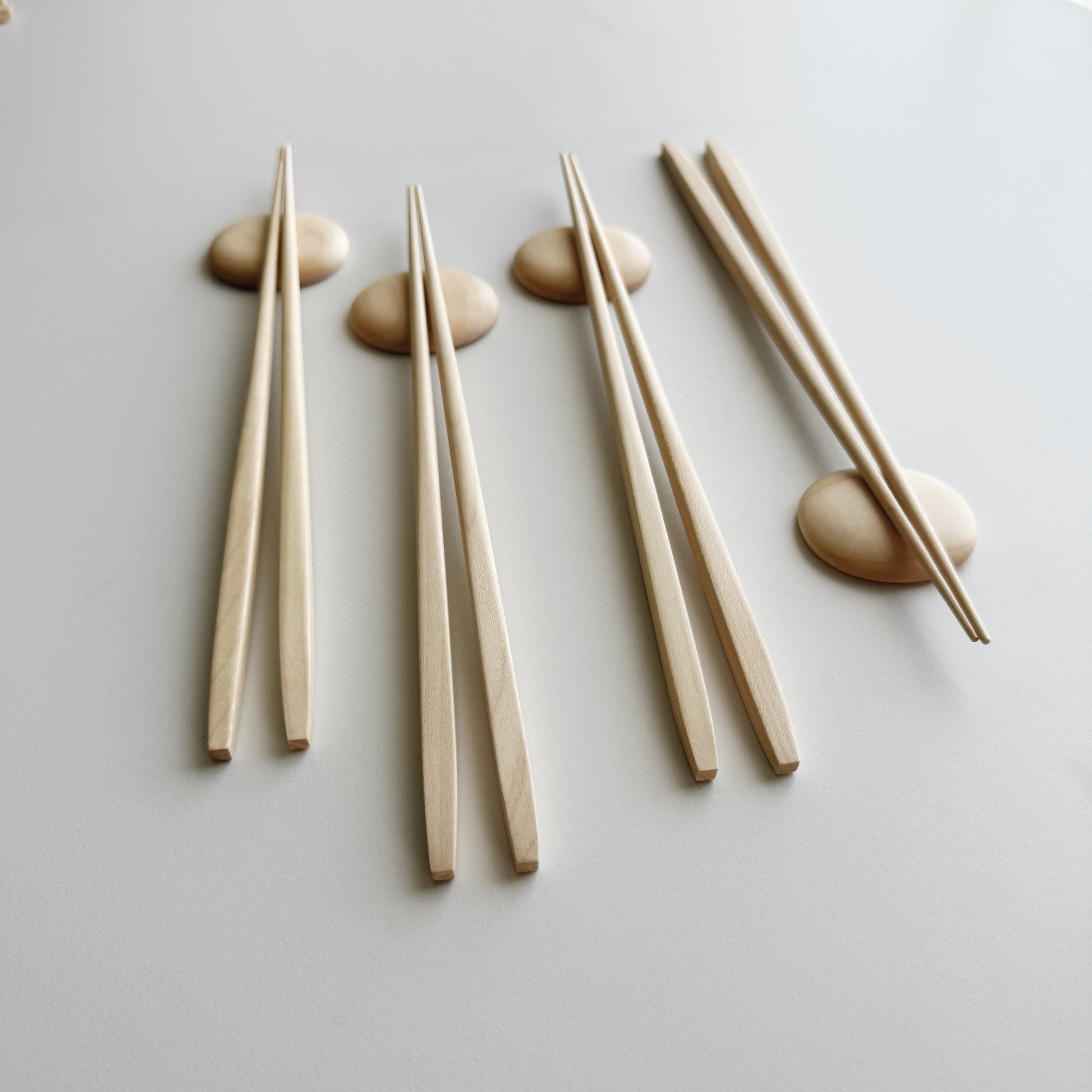 Tapered chopsticks & pebble rest in sycamore