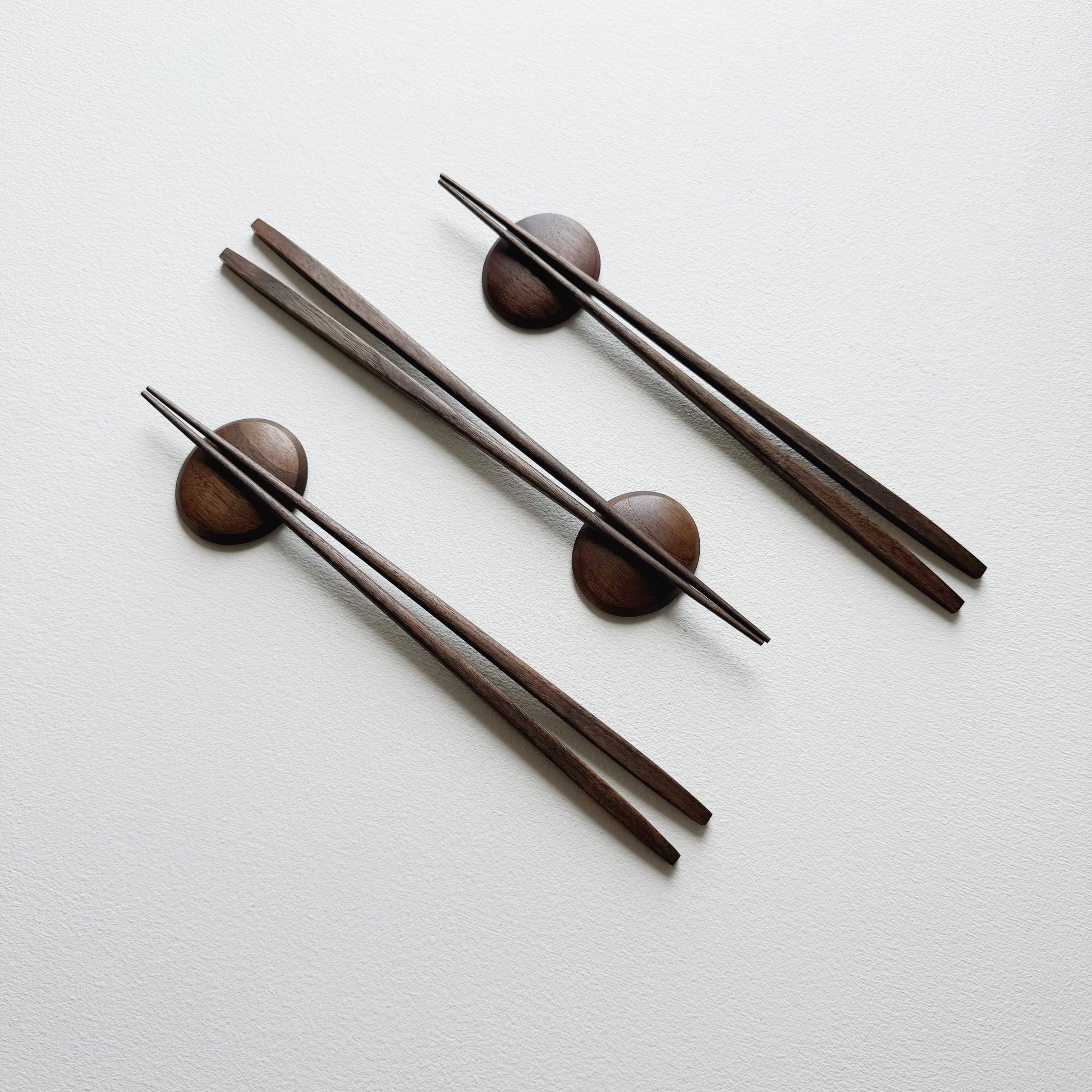 Tapered chopsticks with pebble rest in vintage black walnut