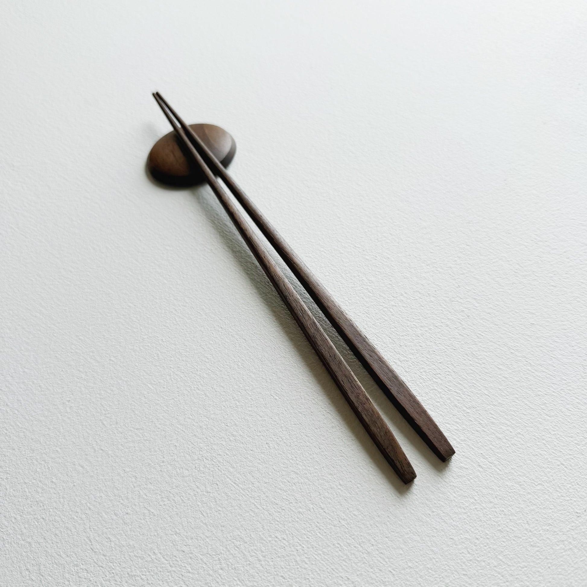 Tapered chopsticks with pebble rest in vintage black walnut