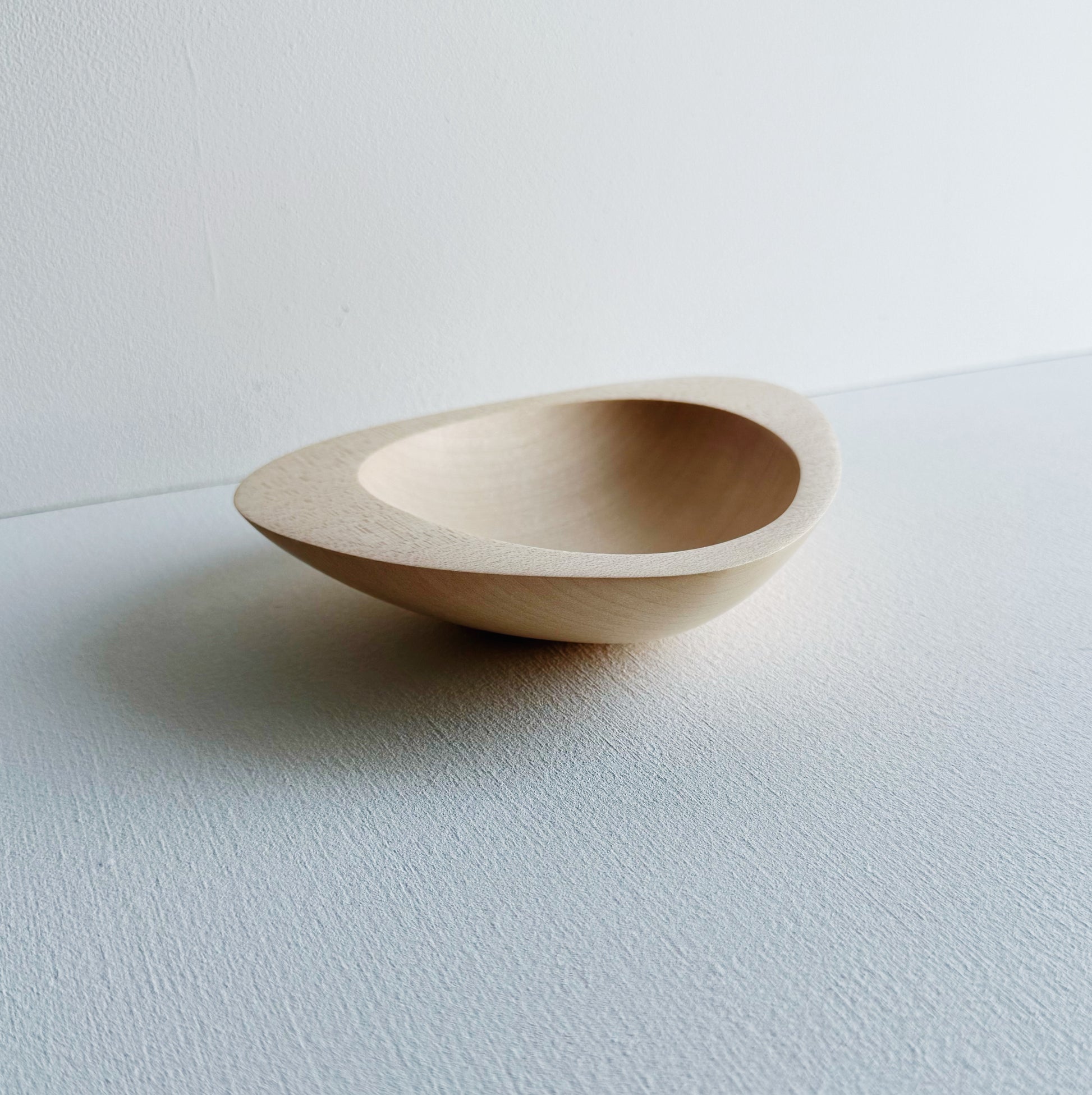 Triangular bowl in sycamore