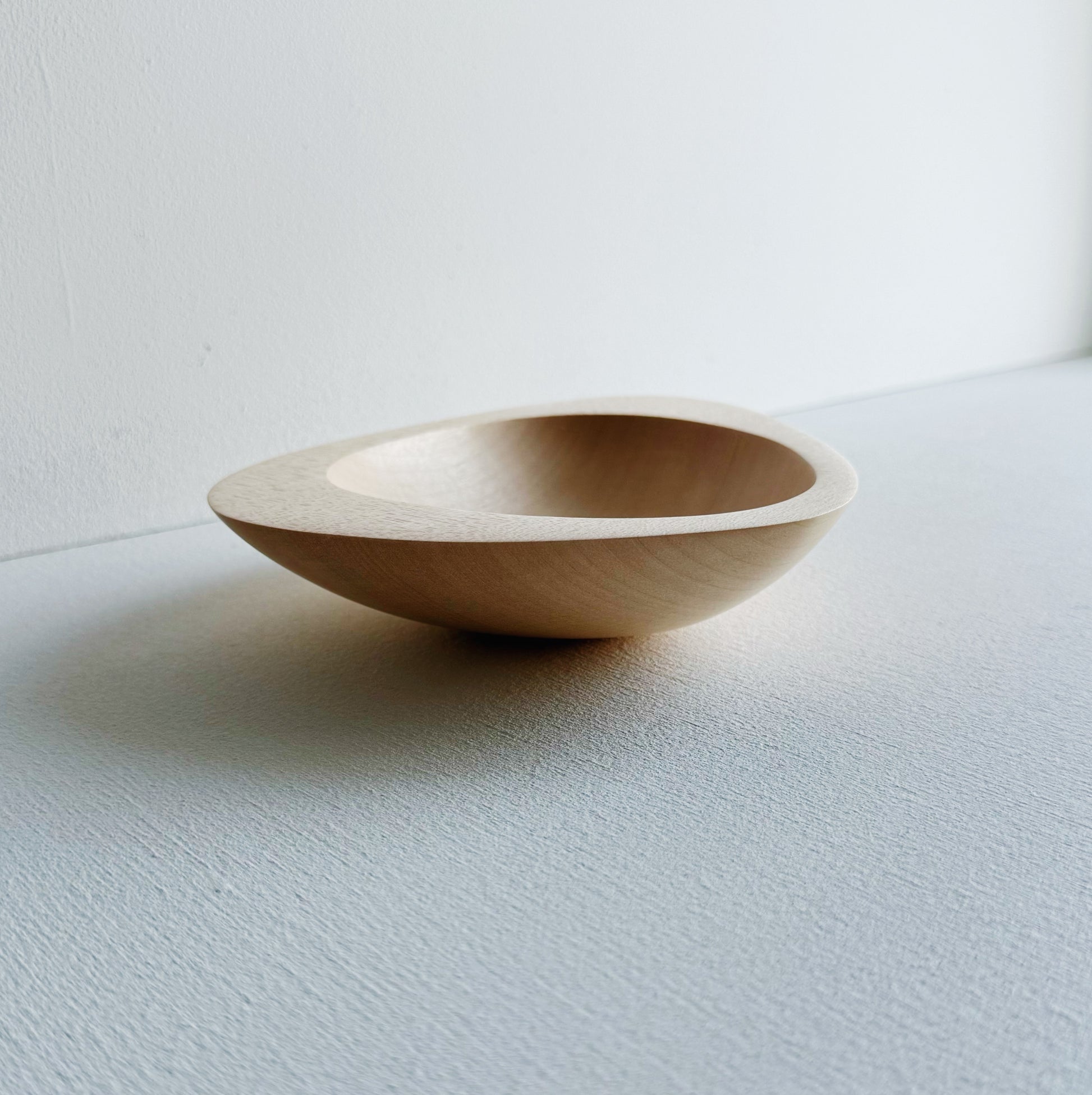 Triangular bowl in sycamore