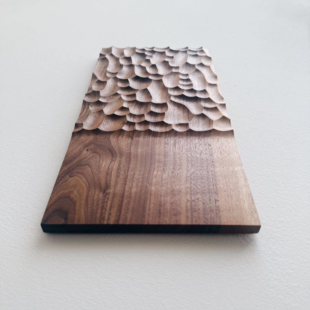 Two tone walnut presentation board on a white background 