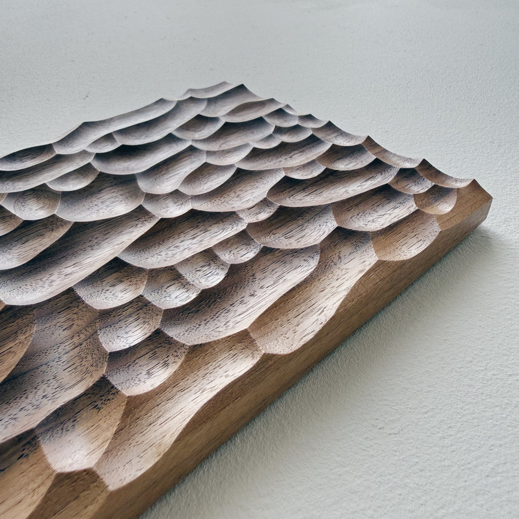 Two tone walnut presentation board on a white background 