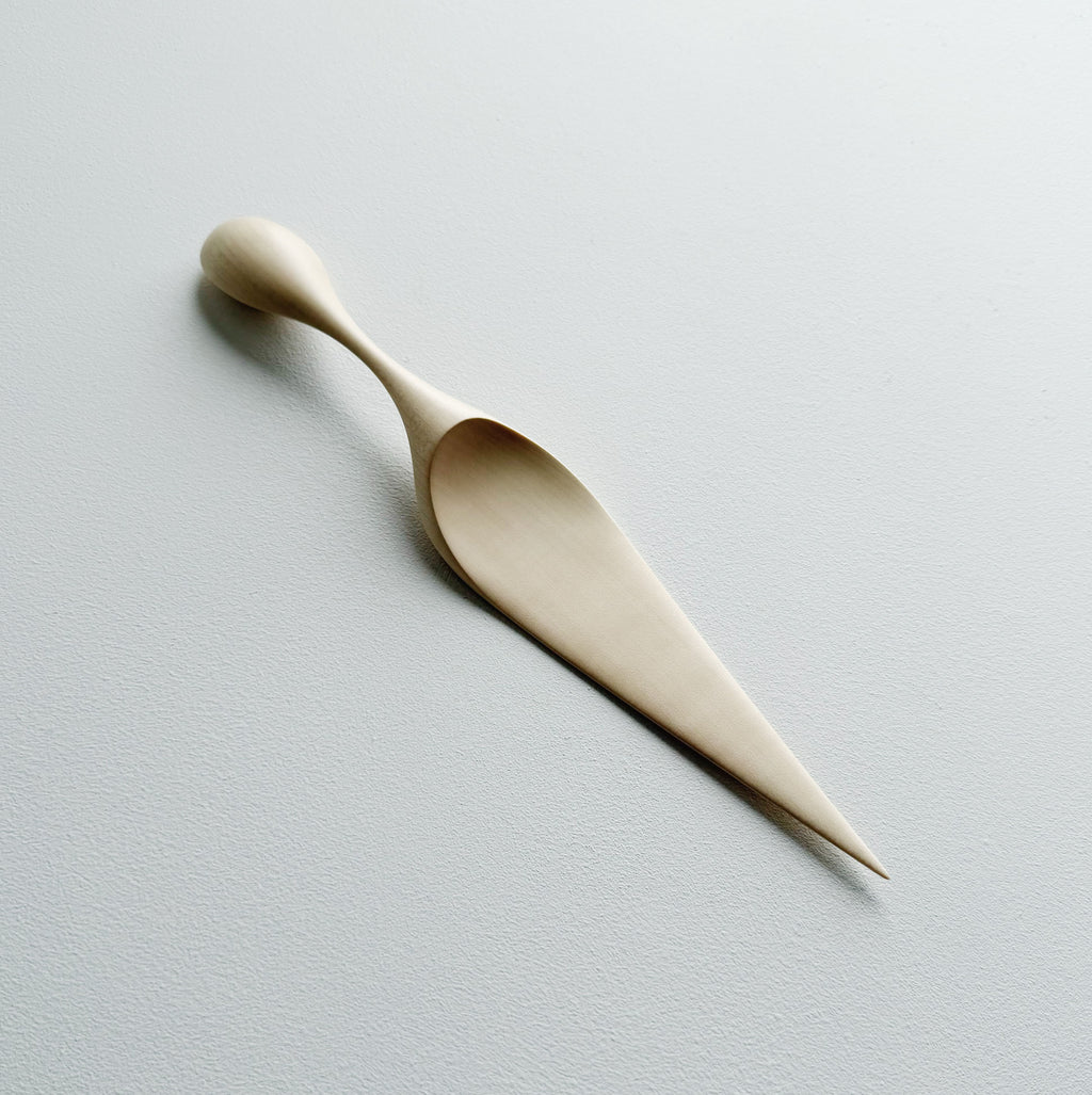Sycamore cake server on a light background
