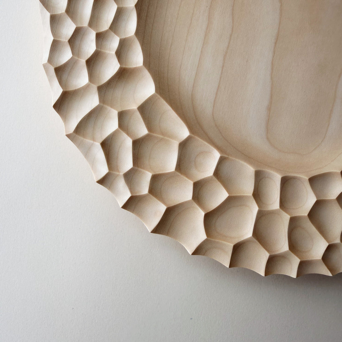 Crater charger plate in sycamore
