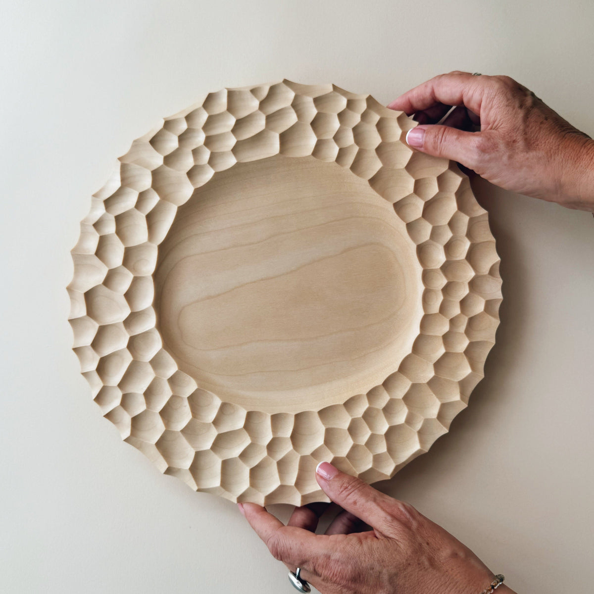Crater charger plate in sycamore