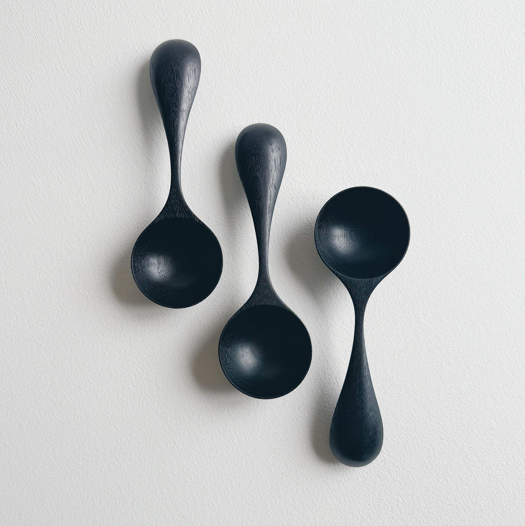 Curvy scoop in ebonised walnut