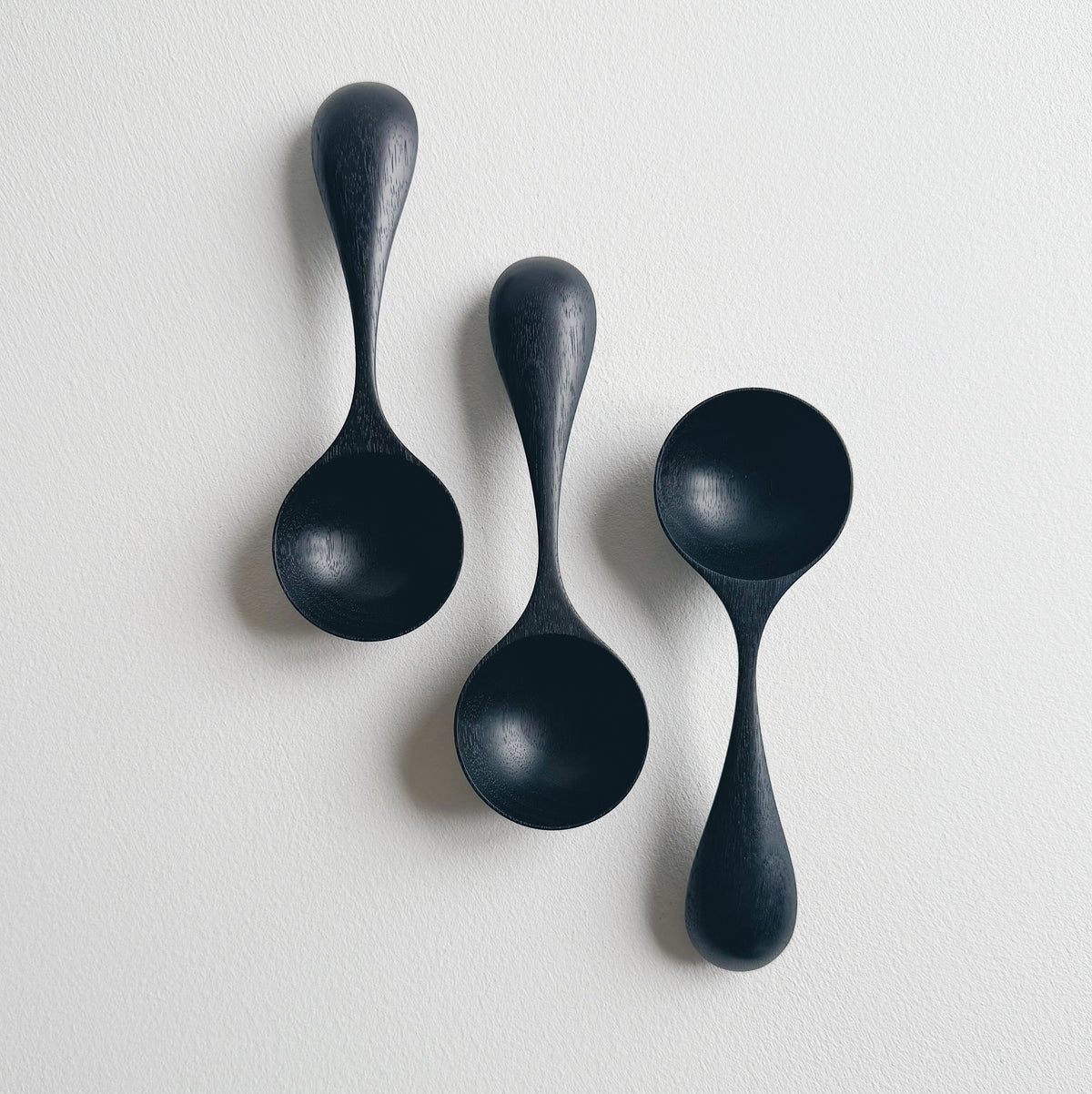 Curvy scoop in ebonised walnut
