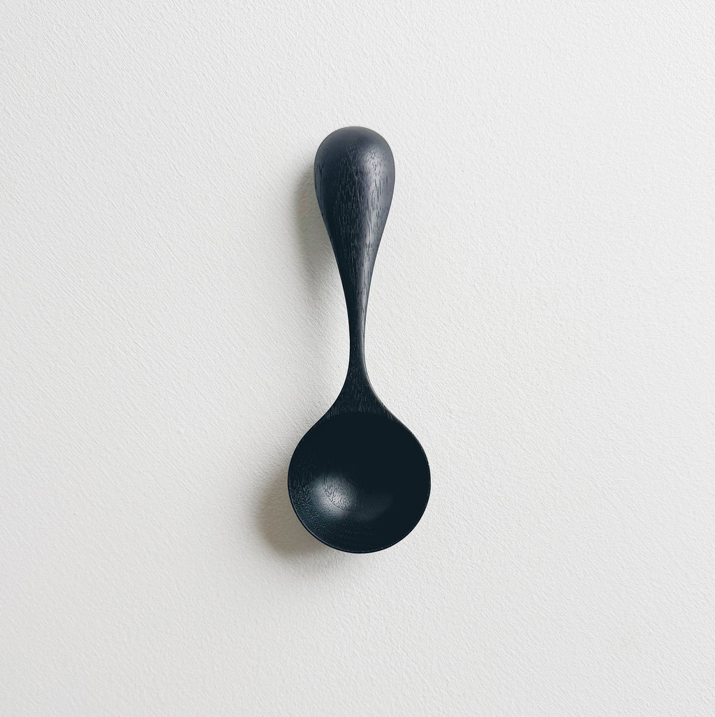 Curvy scoop in ebonised walnut