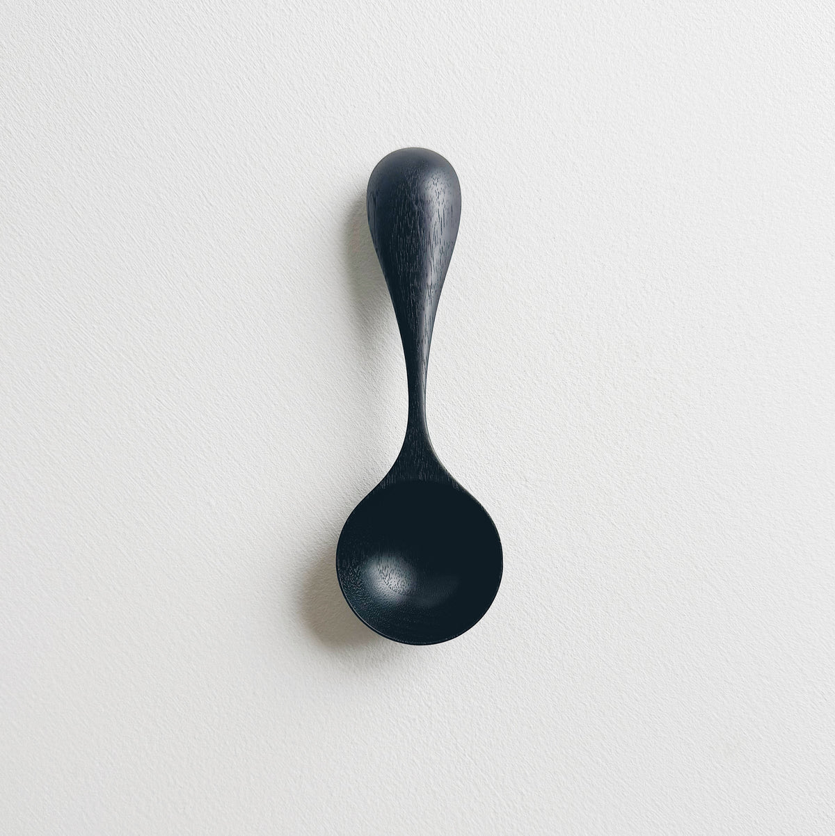 Curvy scoop in ebonised walnut