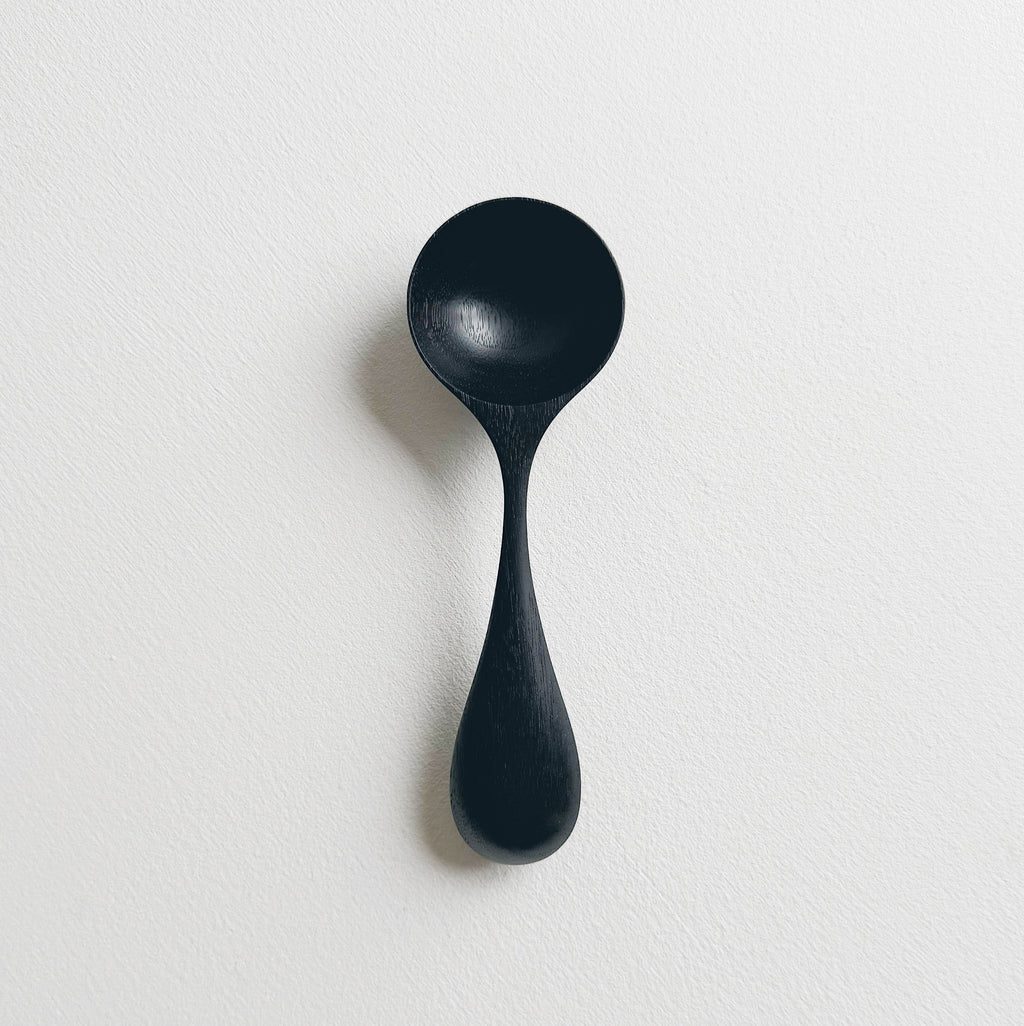 Curvy scoop in ebonised walnut