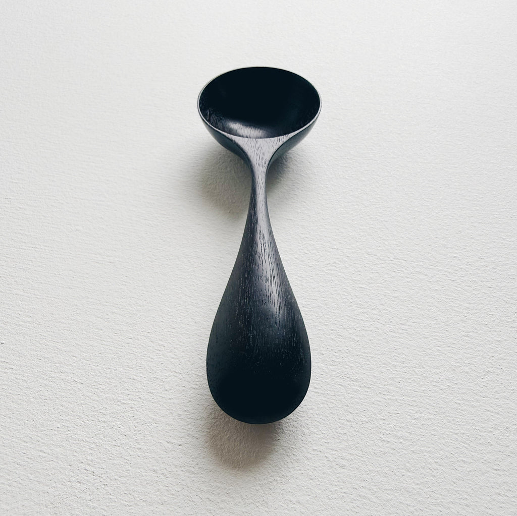 Curvy scoop in ebonised walnut