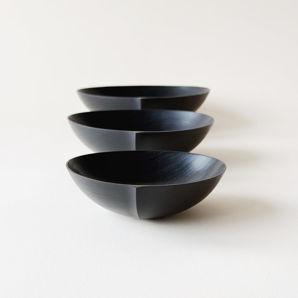 Oval nesting bowls in ebonised walnut - set of three