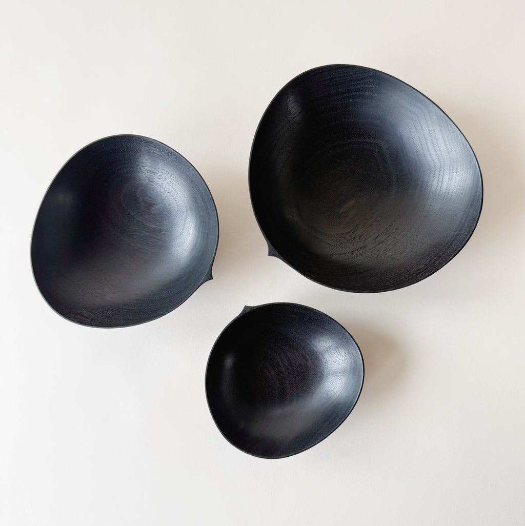 Oval nesting bowls in ebonised walnut - set of three