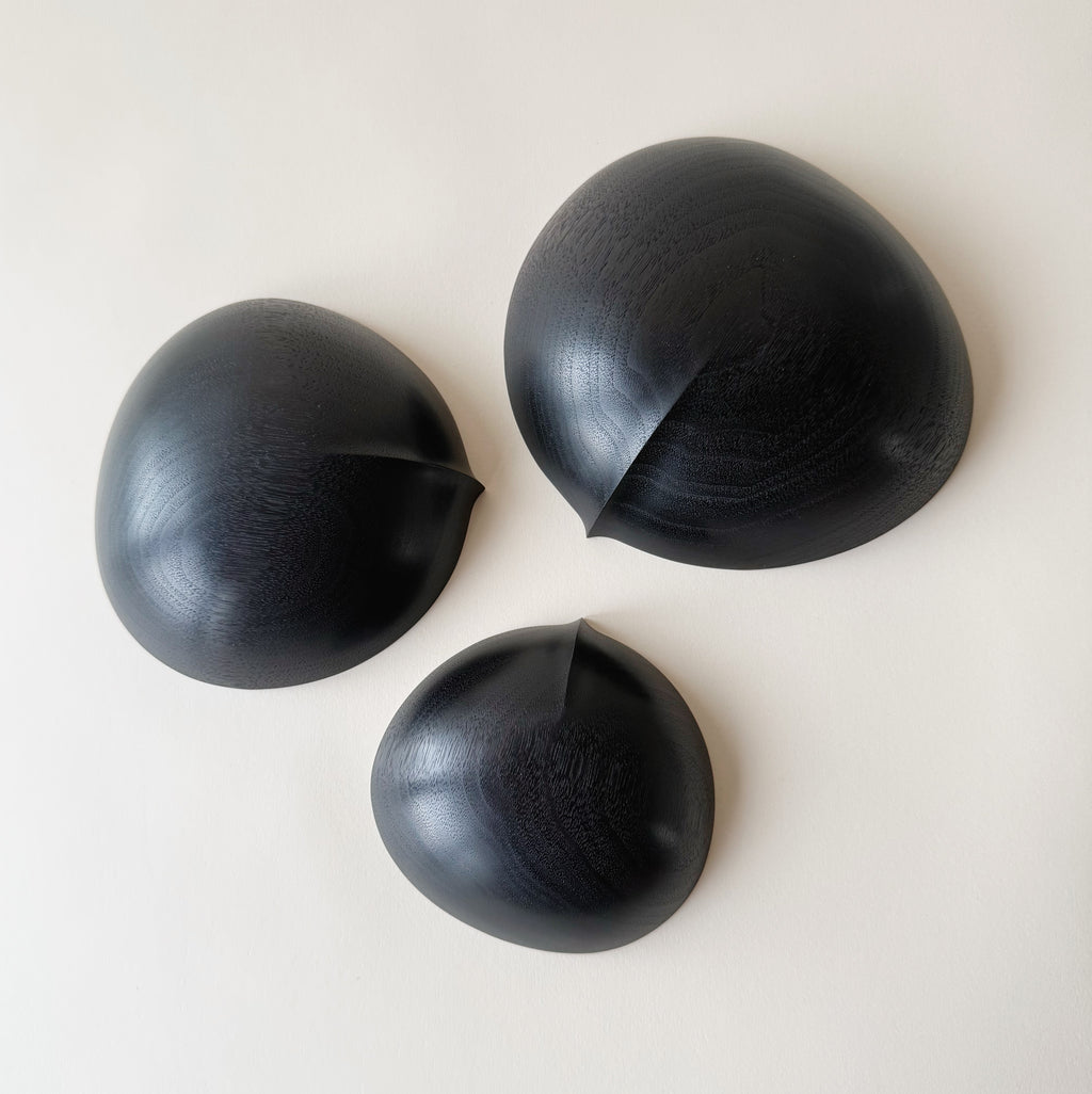Oval nesting bowls in ebonised walnut - set of three