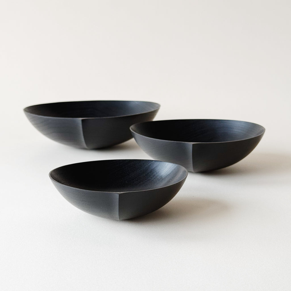 Oval nesting bowls in ebonised walnut - set of three
