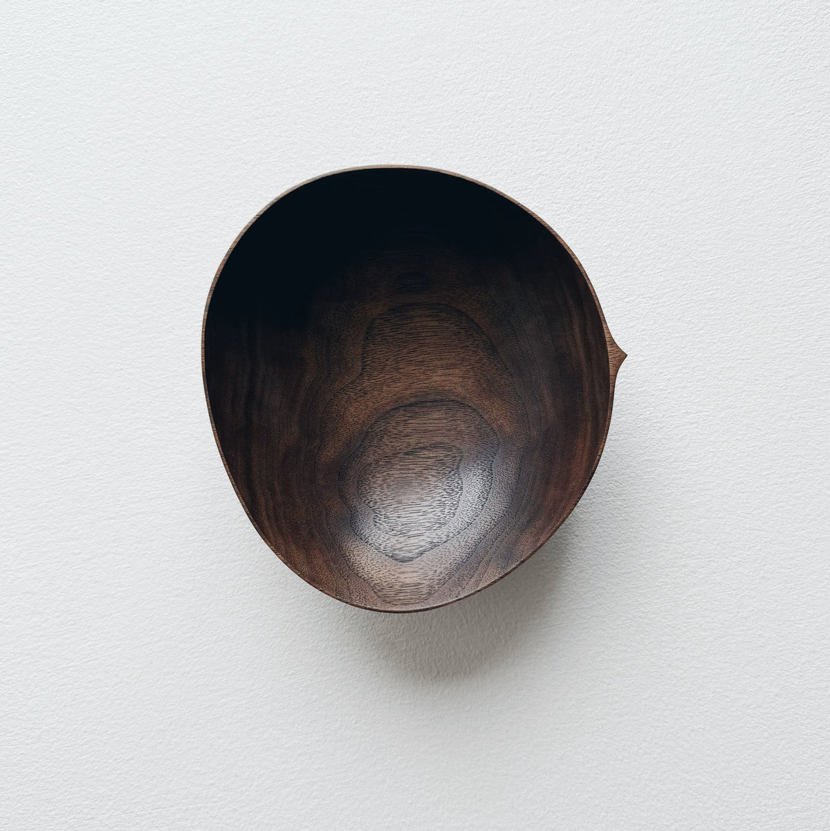 Oval palm bowl in vintage black walnut