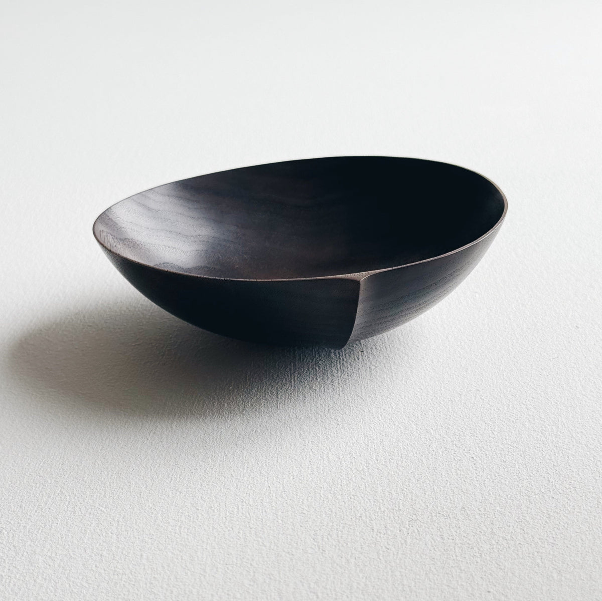Oval palm bowl in vintage black walnut