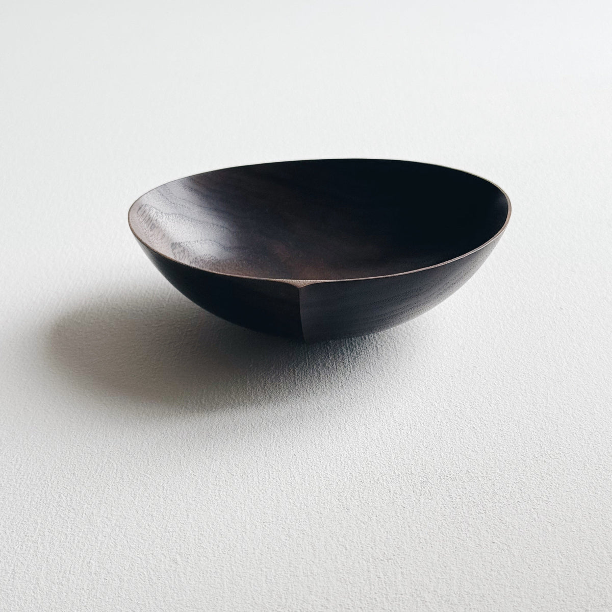 Oval palm bowl in vintage black walnut