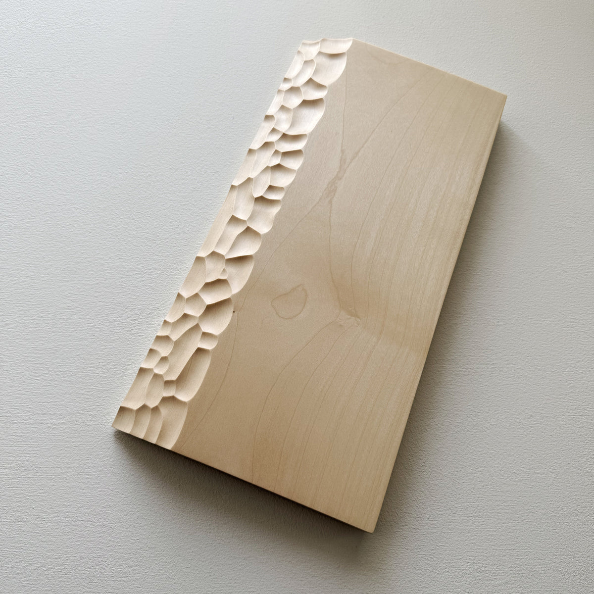 Sculpted presentation board set in sycamore