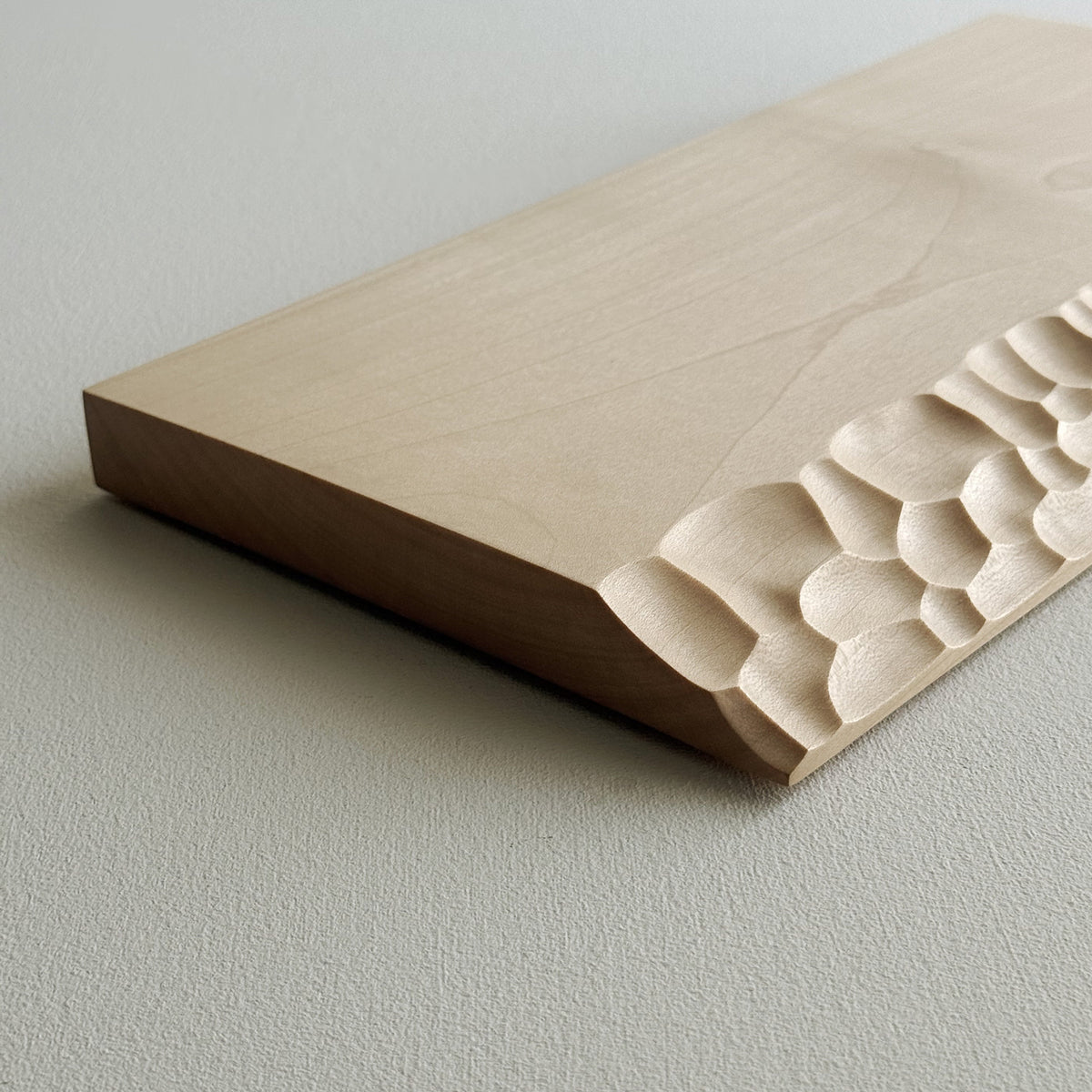 Sculpted presentation board set in sycamore