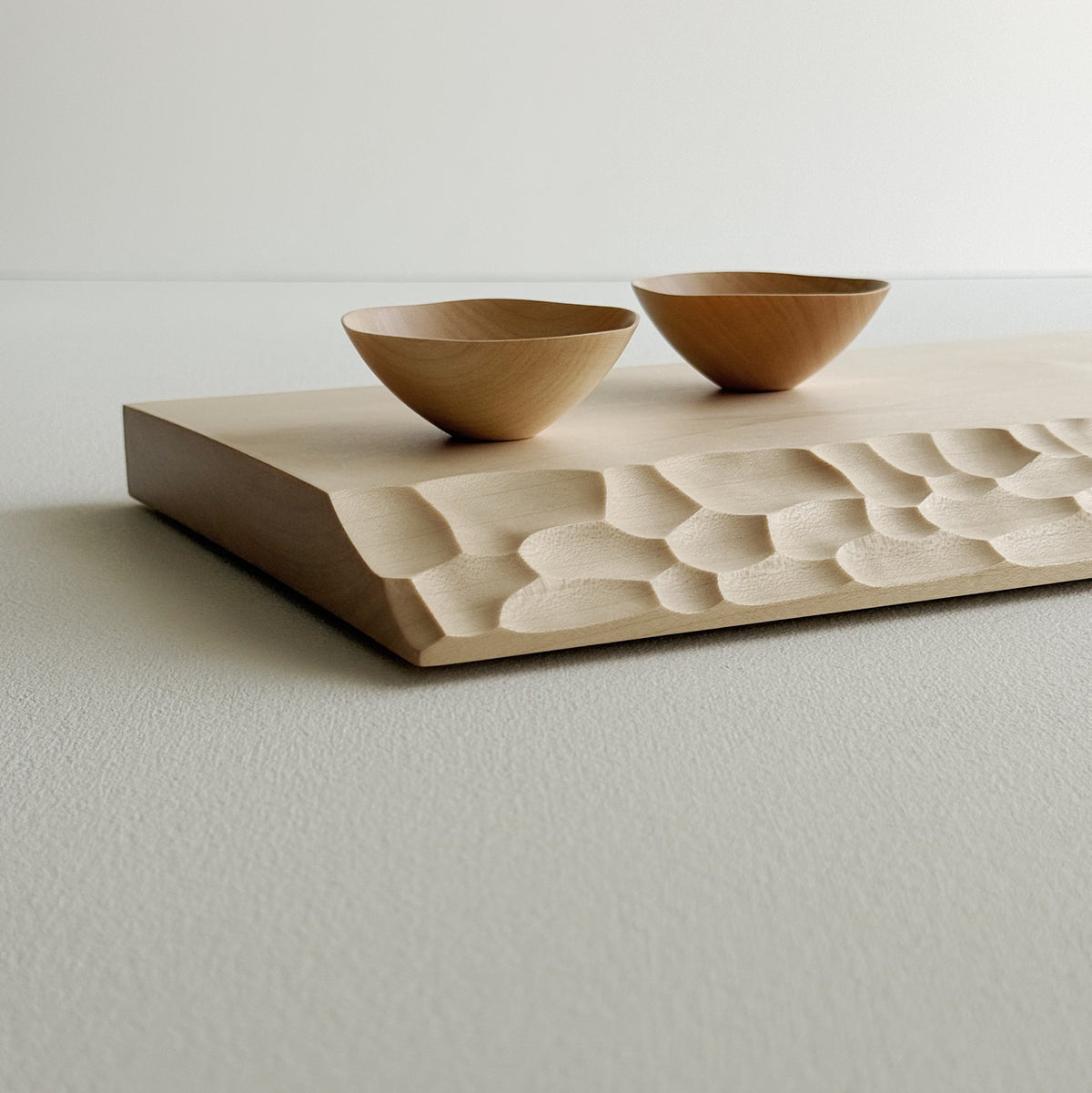 Sculpted presentation board set in sycamore