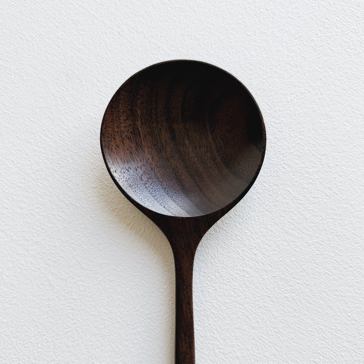 Serving spoon in dark walnut