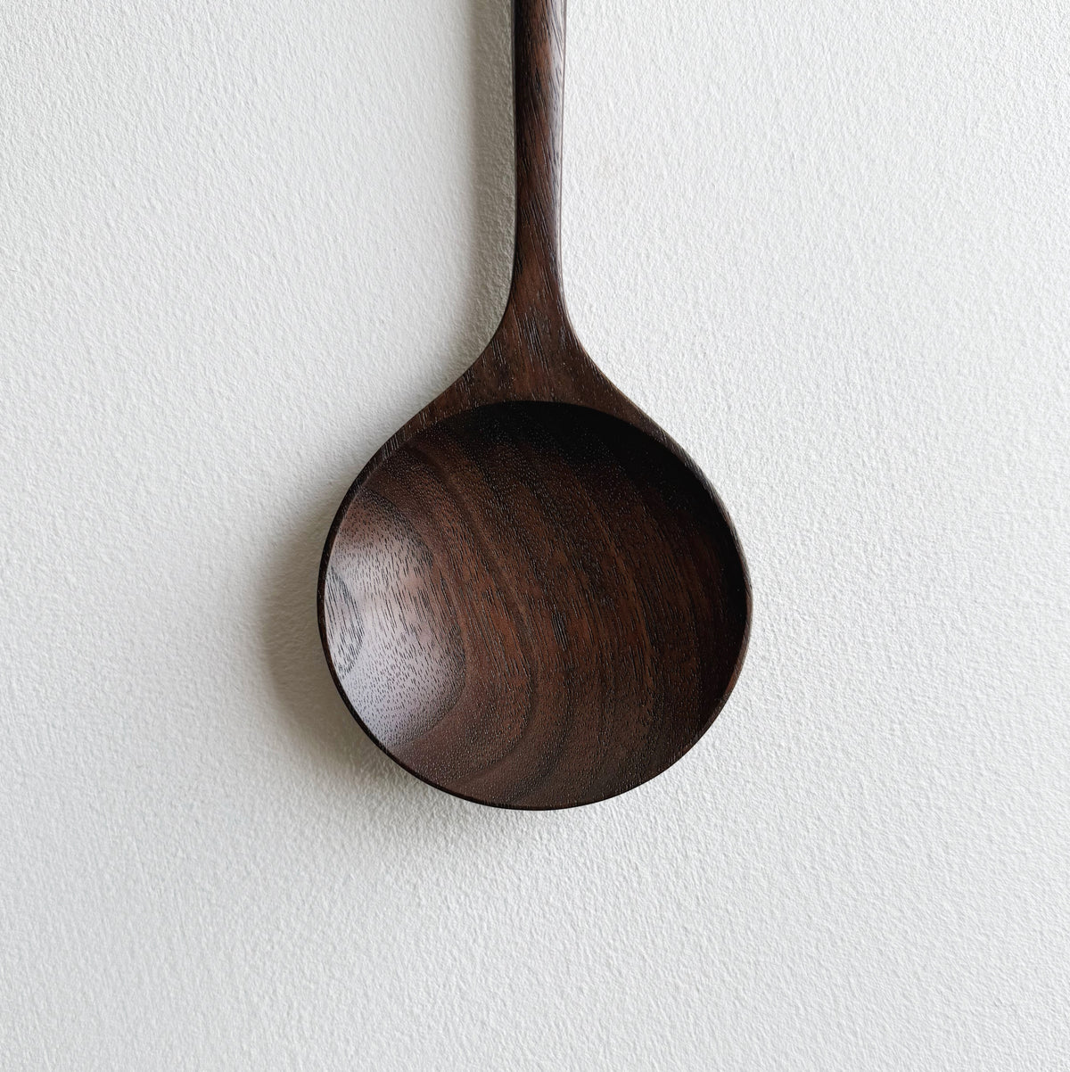 Serving spoon in dark walnut