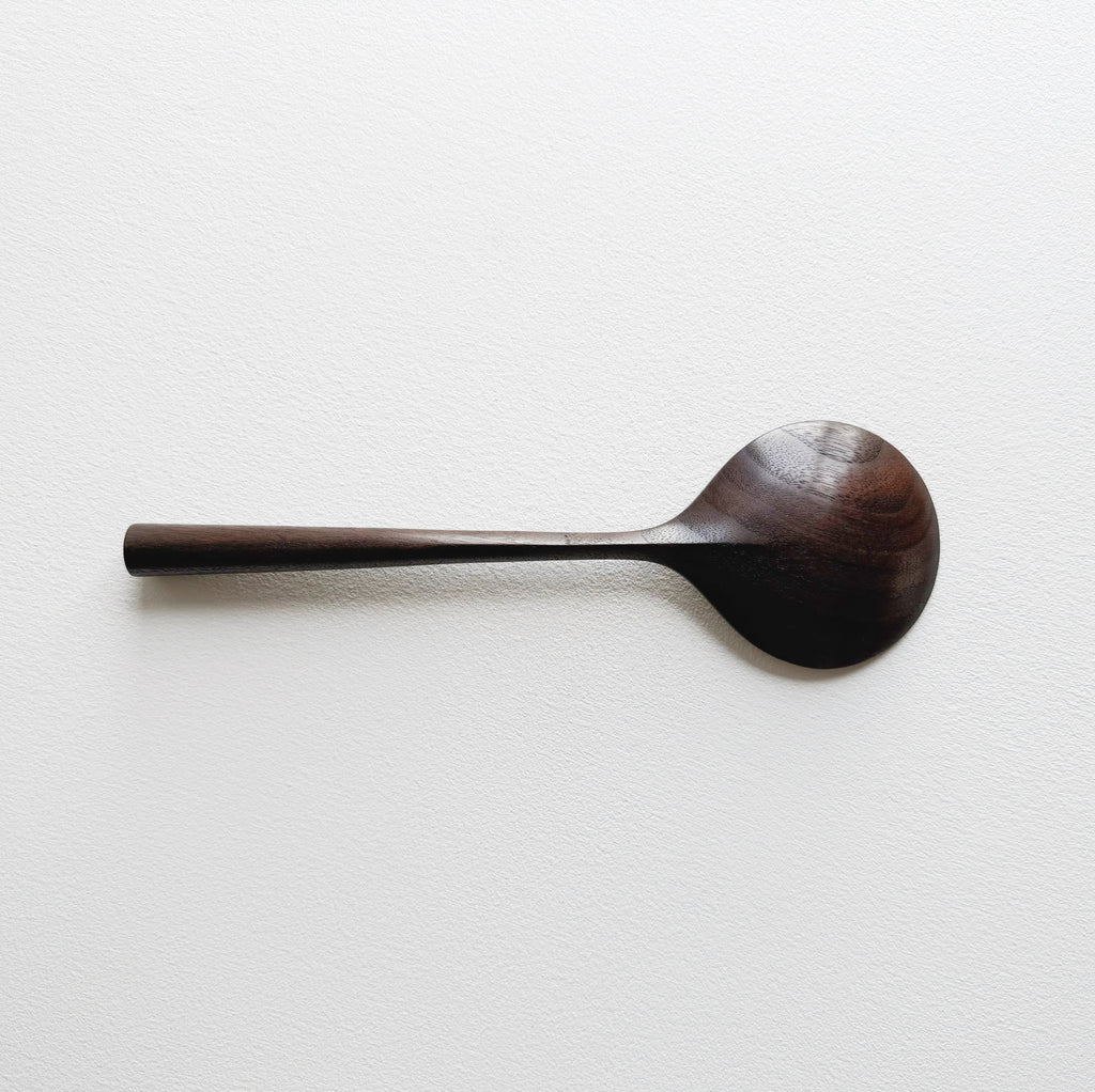 Serving spoon in dark walnut