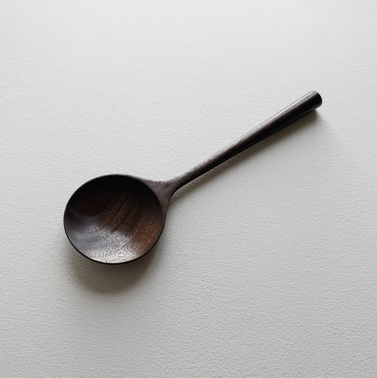 Serving spoon in dark walnut