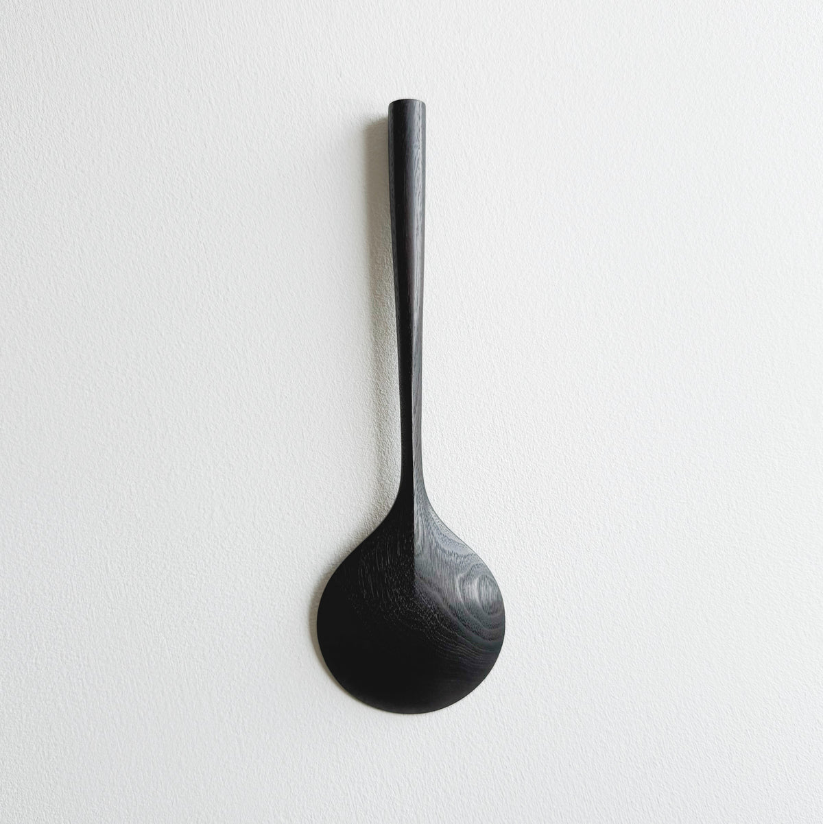 Serving spoon in ebonised walnut