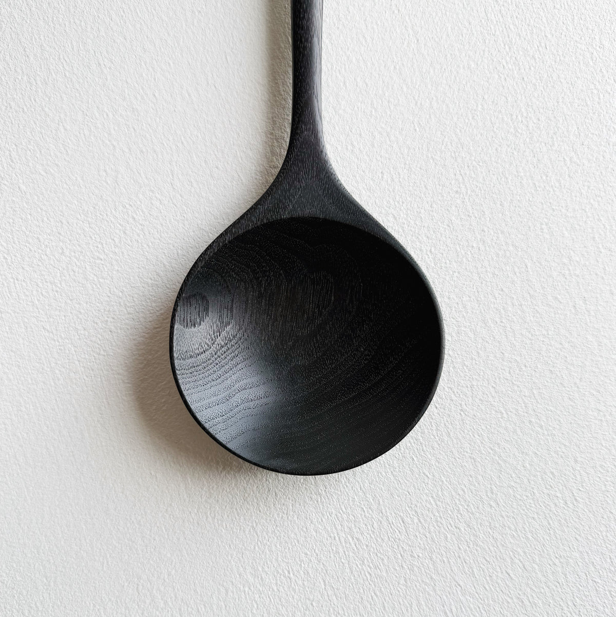 Serving spoon in ebonised walnut