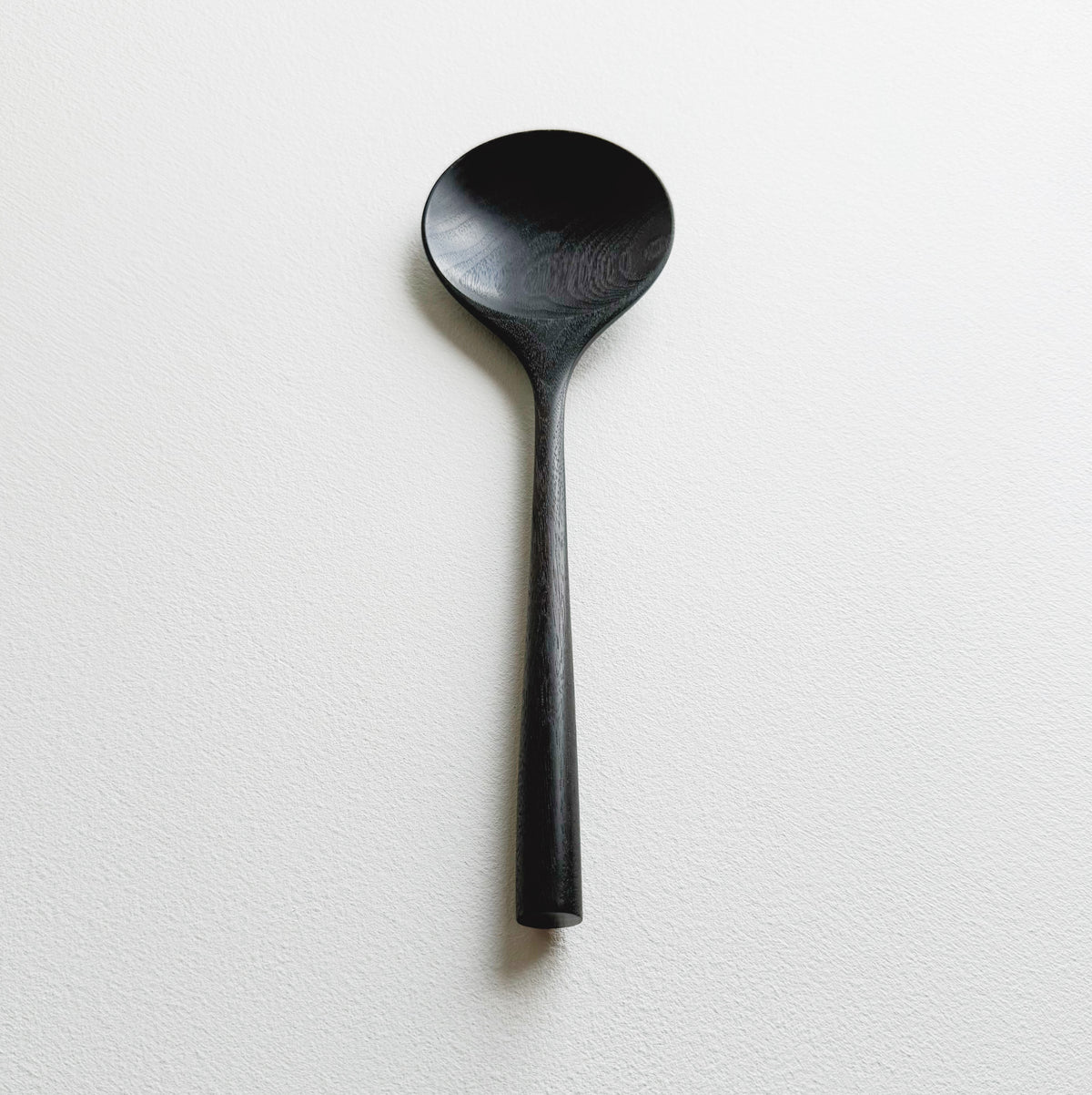 Serving spoon in ebonised walnut
