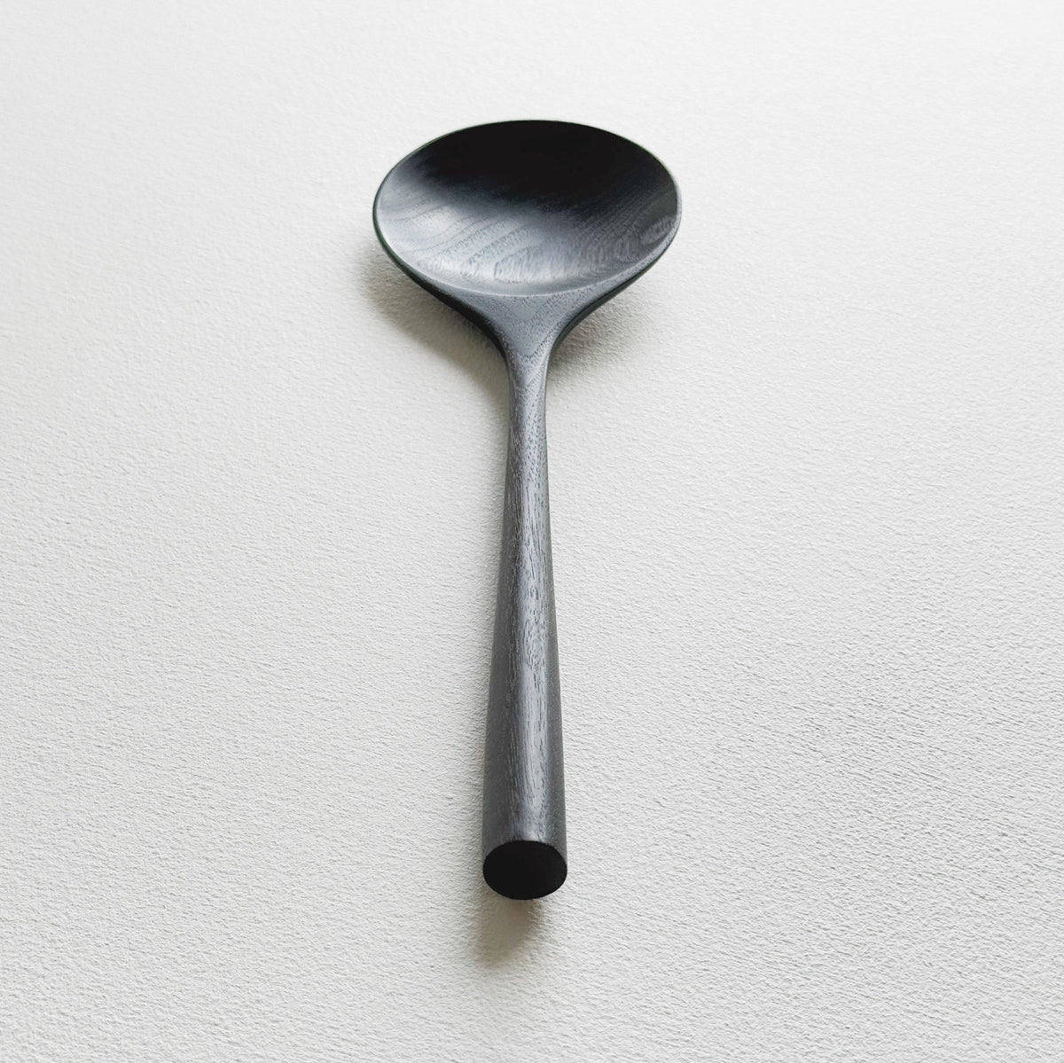 Serving spoon in ebonised walnut