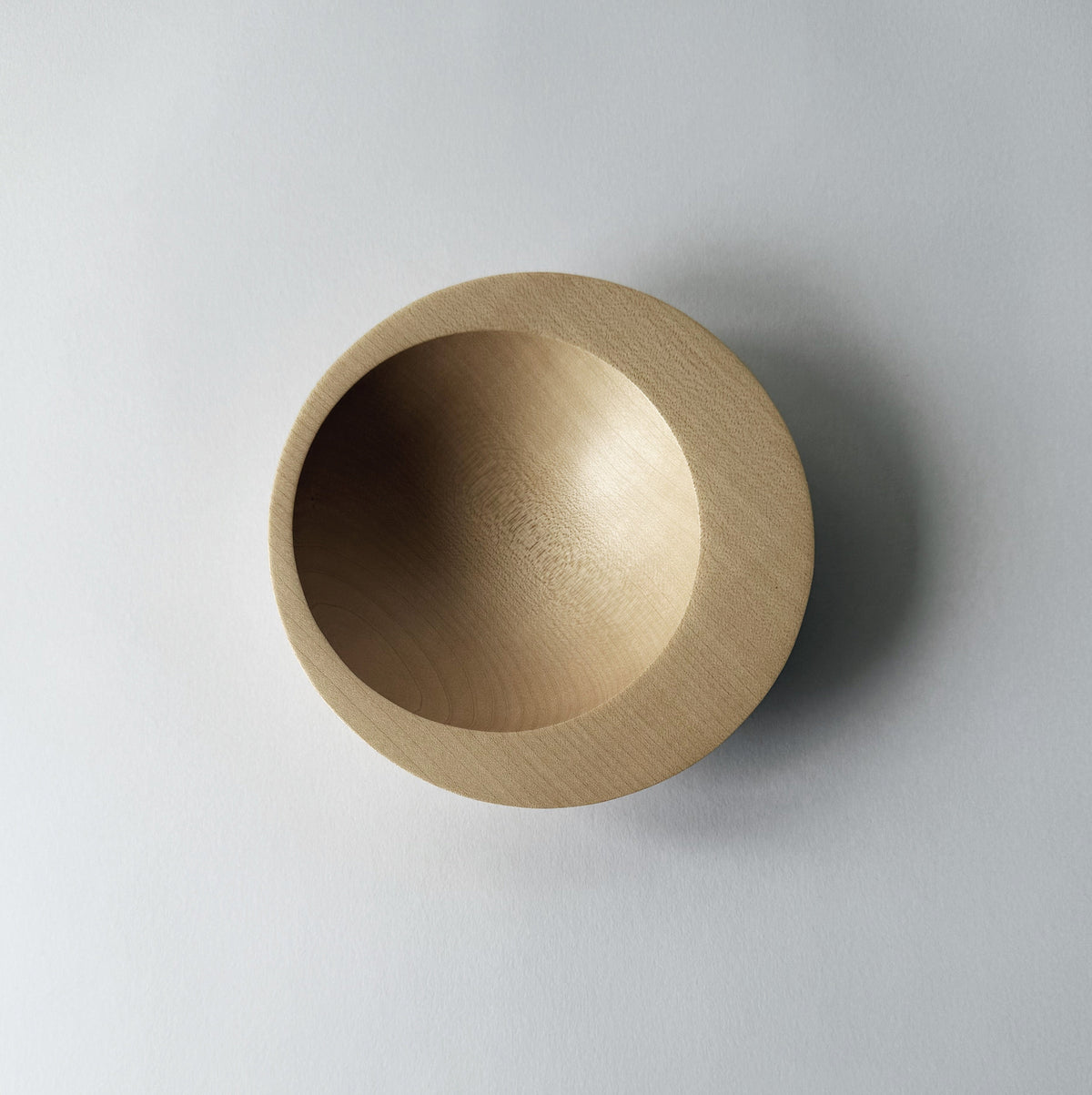Tilted crescent bowl in sycamore
