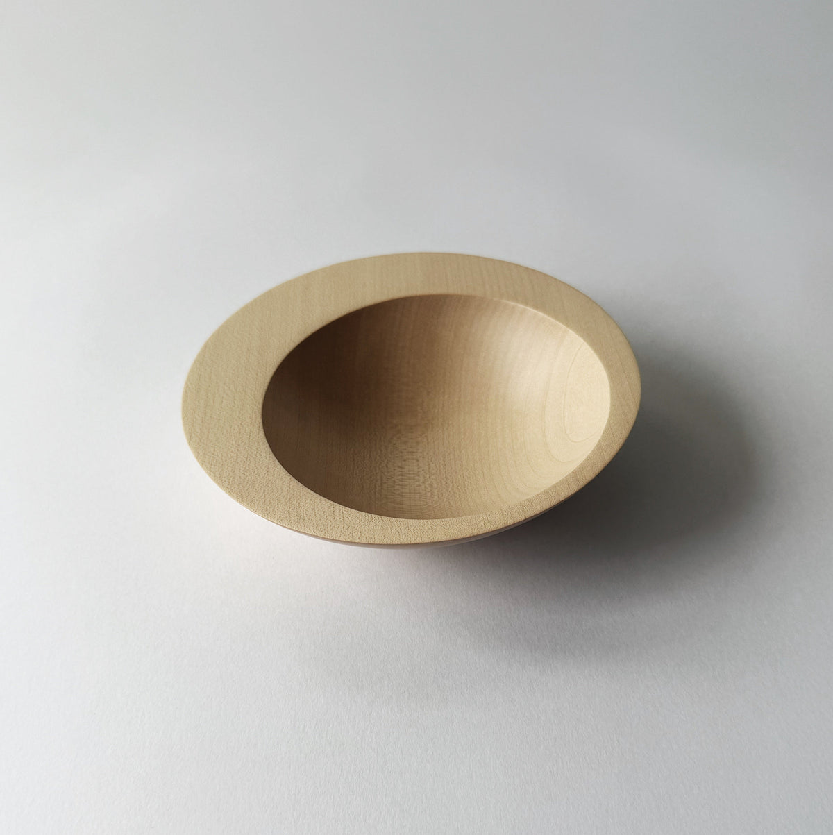 Tilted crescent bowl in sycamore